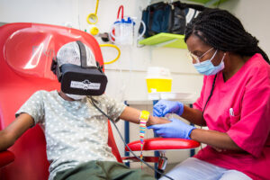 Roudy CHL relaxing kids during painful care